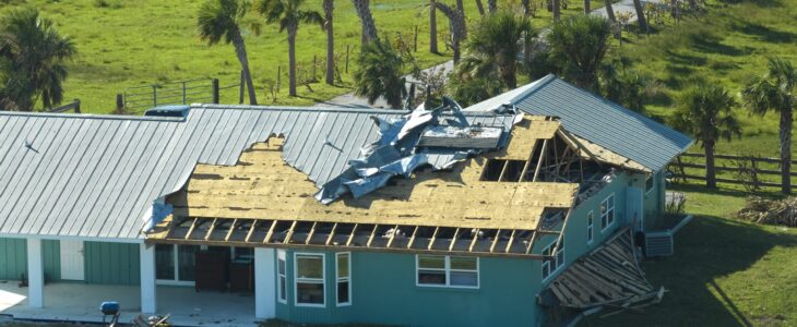 Hurricane Ian destroyed house roof in Florida residential area. Natural disaster and its consequences