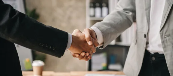 Two businessmen shaking hands after a successful business transaction
